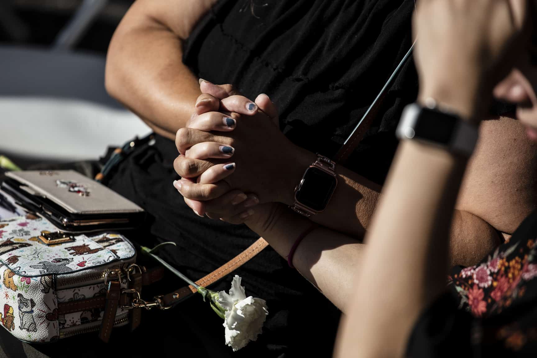 Attendees console one another at a memorial service on the 20th anniversary of the September 11 attacks, in Jersey City.