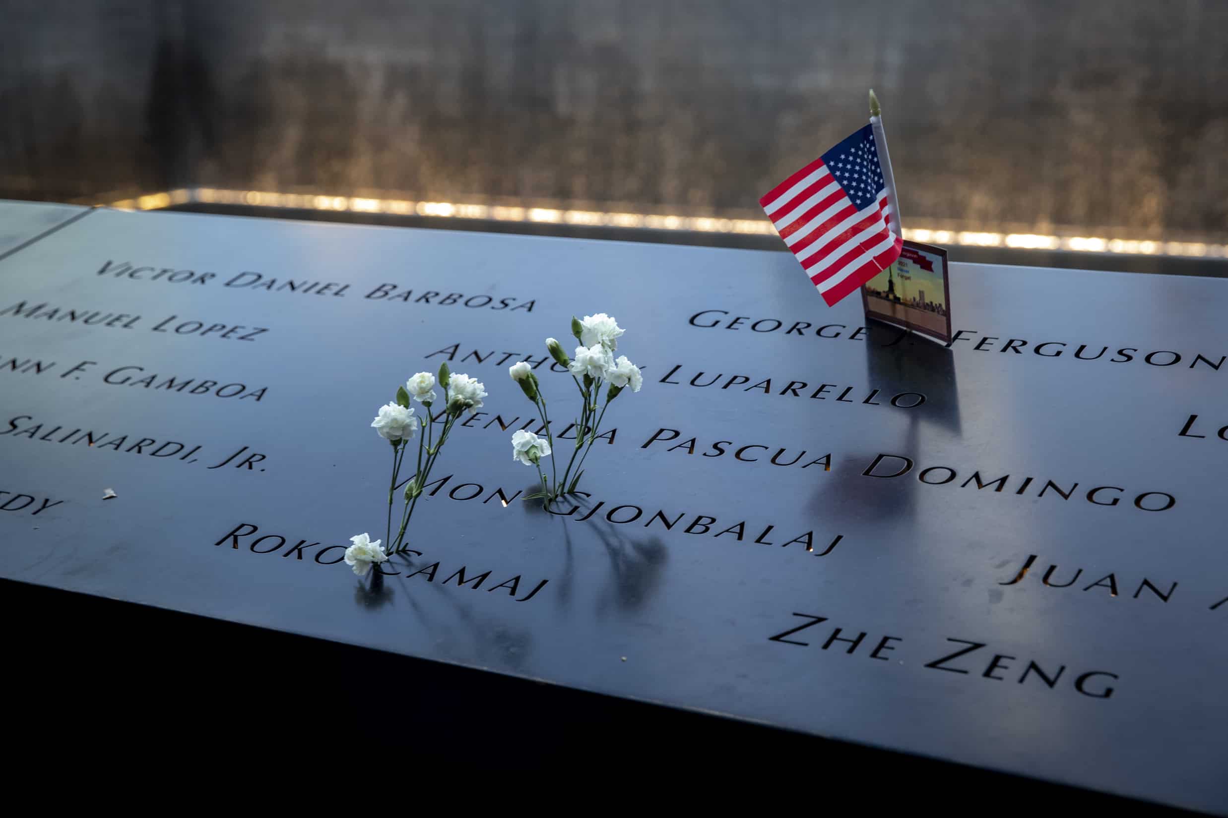 Flowers left at the National September 11 Memorial and Museum in New York on the 20th anniversary of the September 11 attacks, Saturday.