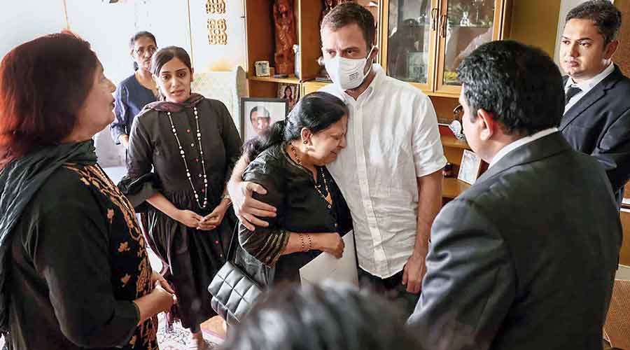 Rahul Gandhi consoles a bereaved family member of veteran Congress leader and former Union minister Oscar Fernandes in Bangalore on Thursday. Fernandes passed away on Monday.