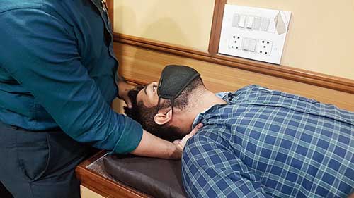 Turn a victim over if he is lying face down with three or four people each turning a part of the body