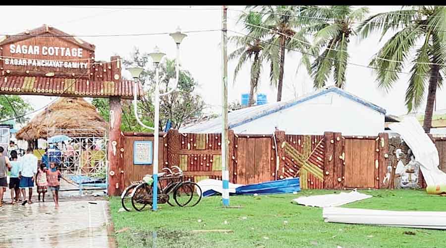 Corrugated sheets, which flew off the roof of tourist cottage Sagar when a column of wind hit the area in South 24-Parganas on Monday, lie on the ground.
