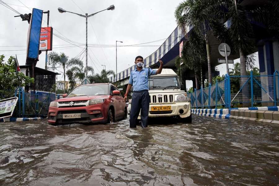 VIP Road on Tuesday morning. Kolkata woke up to slightly less cloudy skies a day after it was battered by record rain sparked by three monster weather systems — two cyclonic circulations and the monsoon trough — ganging up in the skies above it