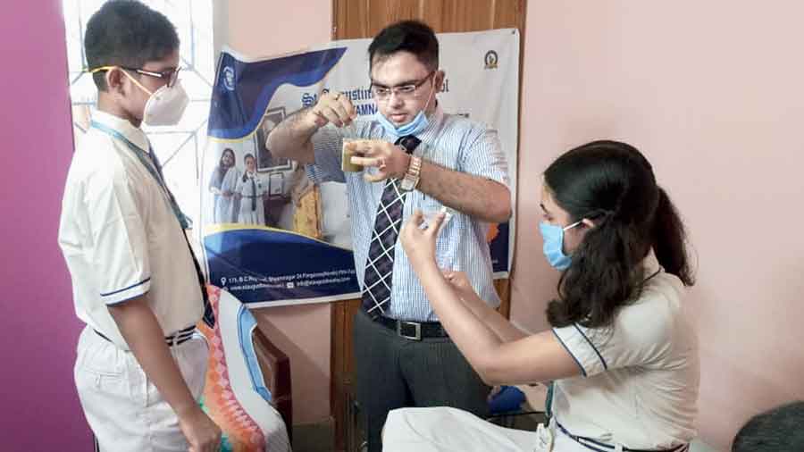 Students of St Augustine’s Day School, Shyamnagar,  conduct experiments at home