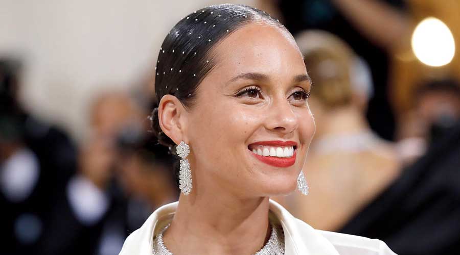 Alicia Keys’s Met Gala 2021 crystal-studded elegantly sleeked-down hairdo was a perfect offset for her understated no-make-up look and ideal for an embellished Navami look