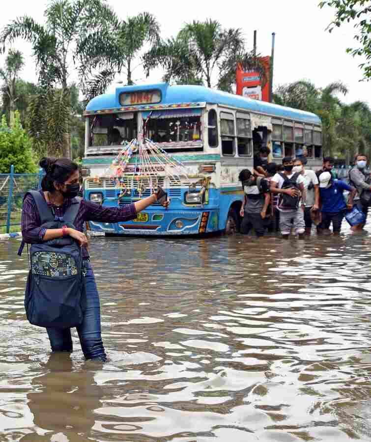 WOE FRAME: A woman takes a selfie on a flooded stretch in the New Town area on Tuesday, September 21. The torrential downpour that began on Sunday night left many vital arteries of the city waterlogged. Salt Lake, New Town and areas in south Kolkata were the worst hit. 