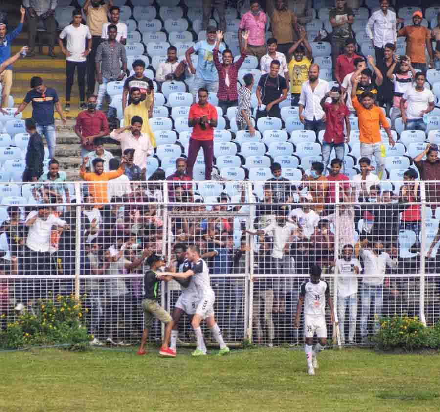 FANS RETURN: A spectator rushes into the ground after Mohammedan Sporting Club scored against Gokulam Kerala during the first quarter final of the Durand Cup at Salt Lake stadium on Friday, September 24. Around 10,000 fans watched the match, a first since the pandemic