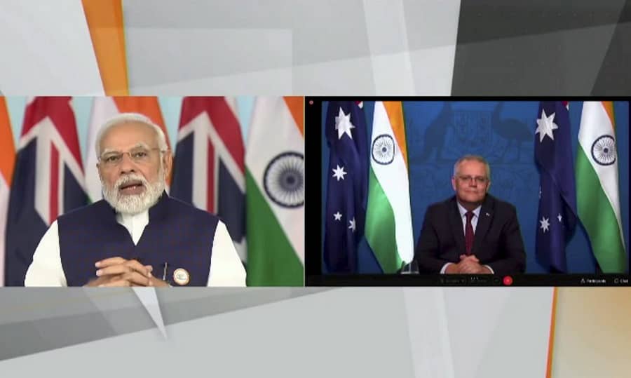 Prime Minister Narendra Modi and his Australian counterpart Scott Morrison (R) during virtual signing ceremony 