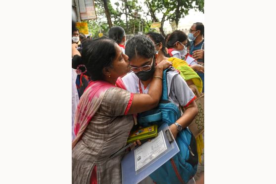 Parents of Class XII students wish them luck before they enter examination centres to appear for their board exams at Bethune Collegiate School  in Kolkata. The West Bengal Higher Secondary 2022 exams began on April 2 with Bengali (A), English (A), Hindi (A), Nepali (A), Urdu, Santhali, Odia, Telugu, Gujarati or Punjabi paper. 
