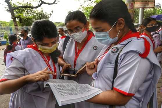 Last-minute revision outside an examination centre. Over 7 lakh students appeared for the West Bengal Higher Secondary 2022 exams that began on April 2 
