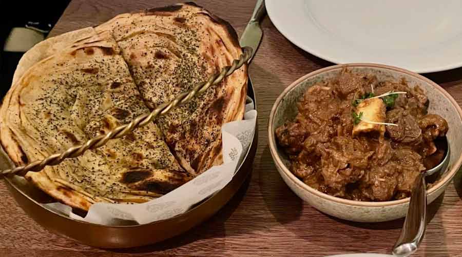 Kosha Mangsho with a bread basket