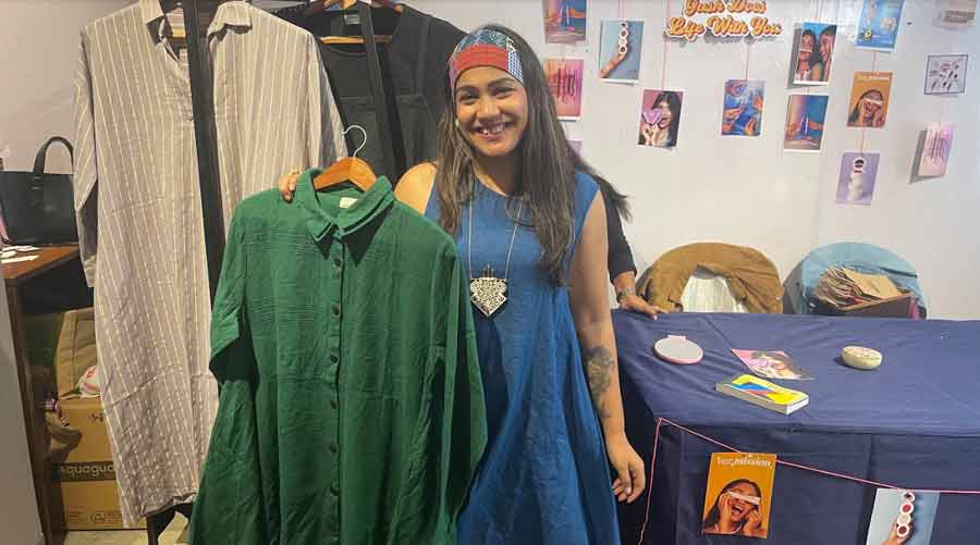 Mamata Sharma Das with one of her creations, a green textured shirt dress