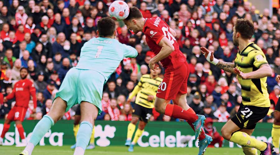 Diogo Jota (right) scores Liverpool’s first goal against Watford FC at Anfield on Saturday. 