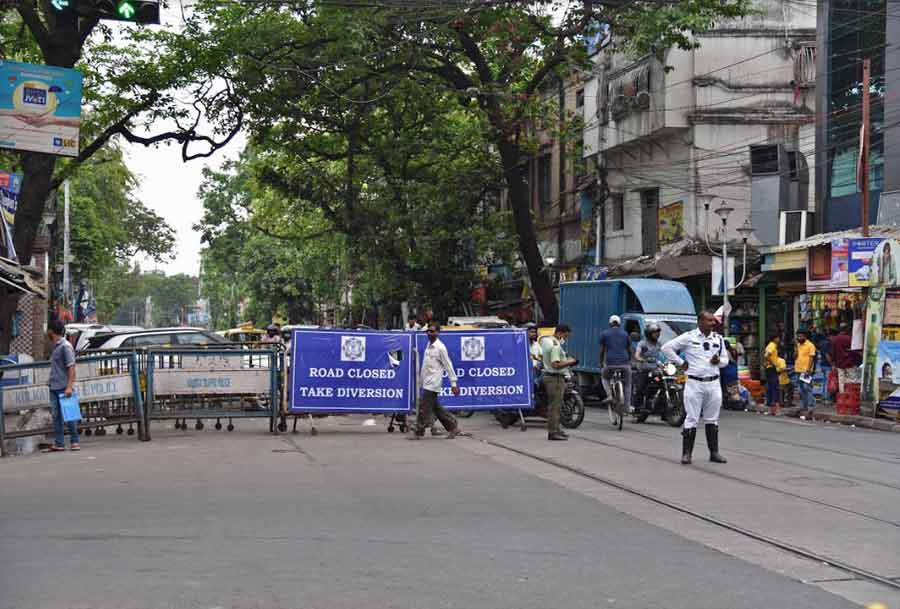 A Kolkata Traffic Police personnel stands guard on Nirmal Chandra Street in the Bowbazar area on Monday. A section of the thoroughfare has been shut to traffic since April 1 to facilitate construction work for the East-West Metro project