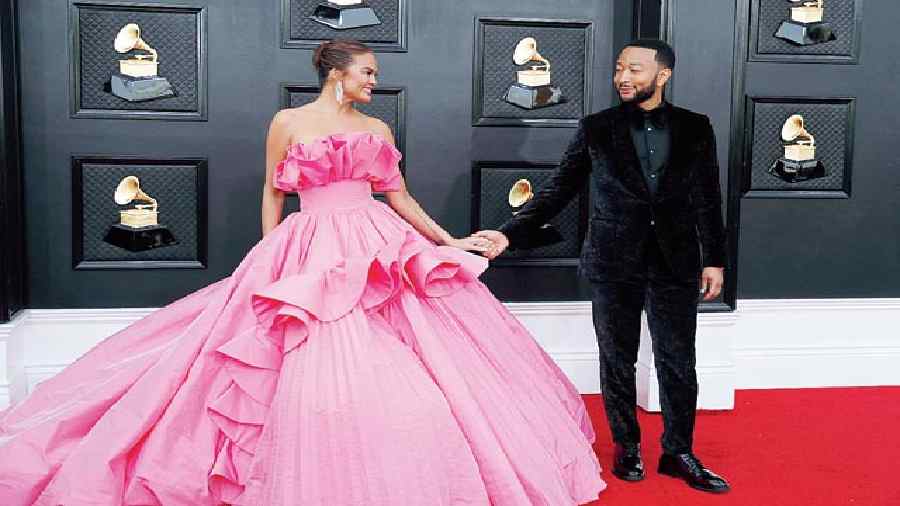 Amidst all the straight and fishtail gowns, Chrissy Teigen’s billowy and ruffled fuchsia pink gown was fresh touch! Hand-in-hand with singer hubby John Legend who opted for a black velvet suit. #PrincessLove