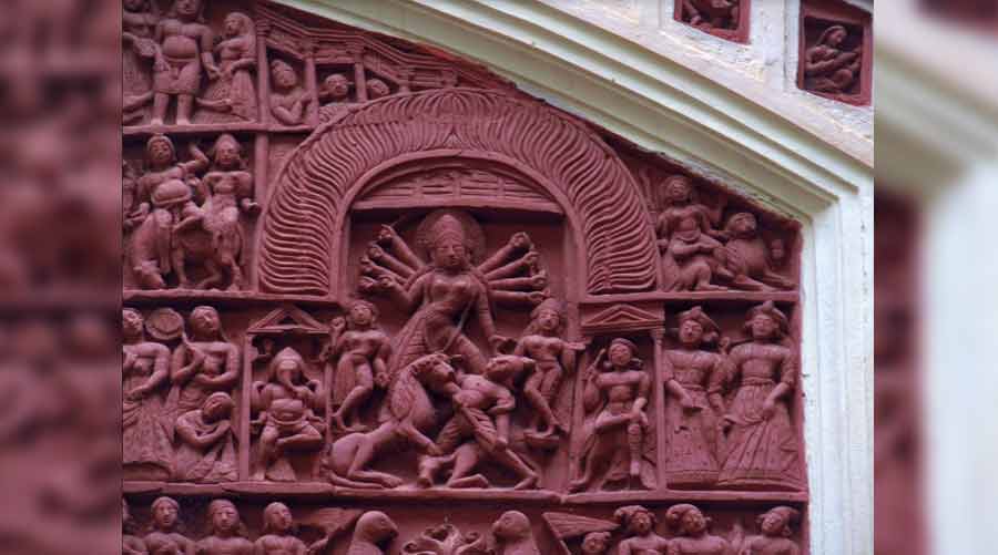 A chalchitra-style panel shows goddess Durga and her family at the Pancha Ratna Lakshmi Janardan temple