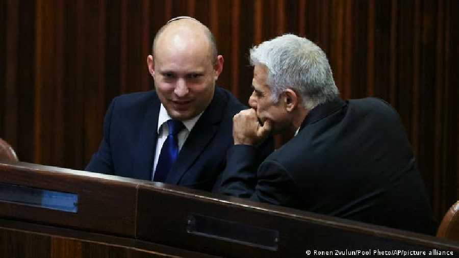 A resignation threatens the coalition of Prime Minister Naftali Bennett, left, and Foreign Minister Yair Lapid.