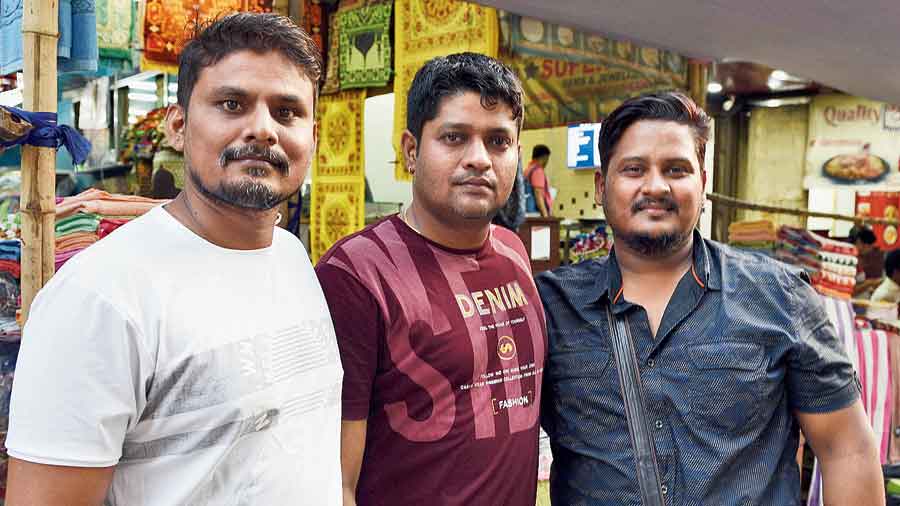(From left) Afzal Khan, Ravi Chourasia and Faisal Ali  on Zakaria Street on Tuesday