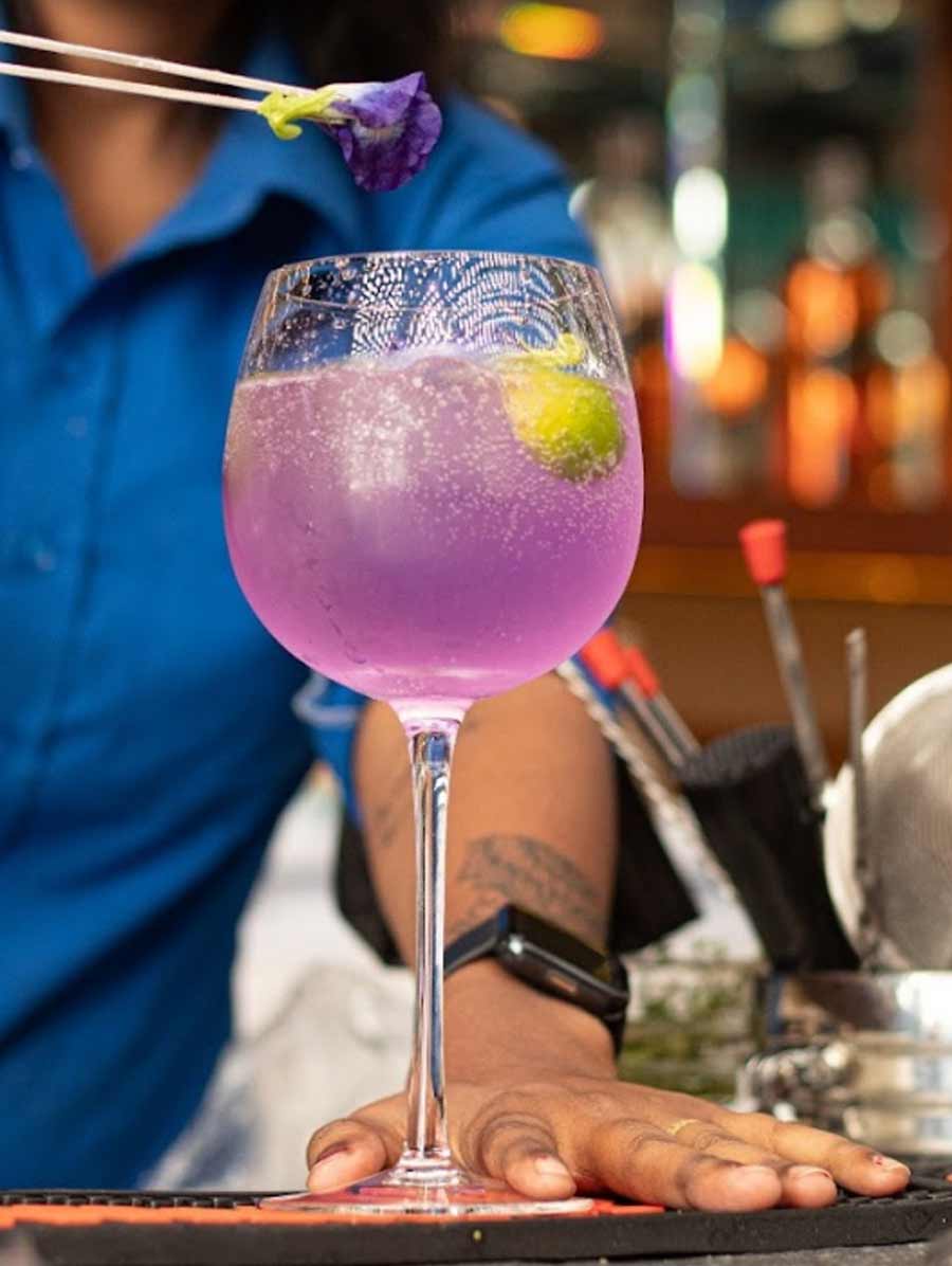 FLORAL G&T AT LMNO_Q: Kolkata’s most packed skybar (yes, even Monday nights are busy atop this Cecilia Park party spot on Park Street) has plenty that raises the bar, thanks to mixologist Shatbhi Basu. Floral G&T drink is like a sip of spring with its gorgeous violet hues. It is infused with butterfly pea flower, which is known to change colours from lavender to blue with a squeeze of citrus. The freshness is enhanced by elderflower that makes the gin sing with every sip