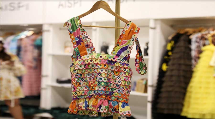 This rainbow top by Spanish designer Celia B was a highlight of the show. The unique fish-scale pattern on the bodice adds a stylised texture to the piece, the tie-up shoulder straps add definition to the top, and the mini-peplum adds volume and drama