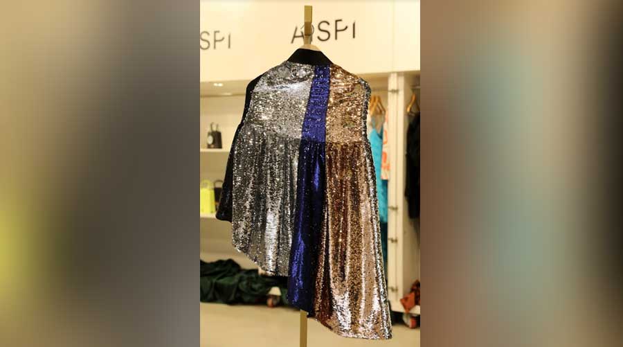 This glamorous sequin skirt is by Fyodor. The complementing colours of bronze, silver and electric blue add playfulness to the party number
