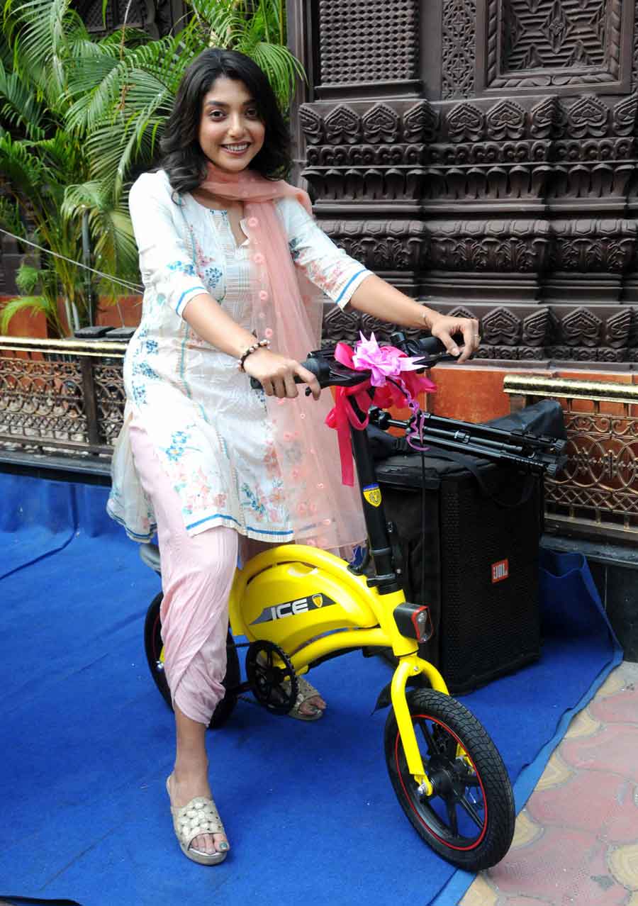 STAR-POWERED: Actor Devlina Kumar rides an e-cycle at a prize distribution ceremony of a lucky draw contest at a city restaurant on Friday, April 8