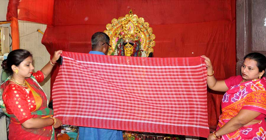 Devotees perform rituals on the occasion of Annapurna Puja on BK Pal Avenue on Saturday
