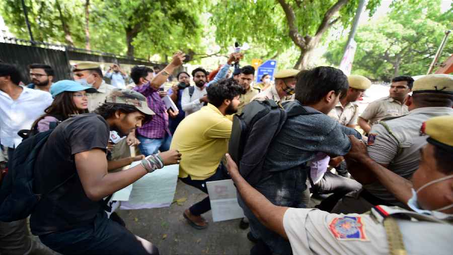 All India Students Association activists stage a protest, after after two groups of students clashed at JNUs Kaveri Hostel on Sunday, in New Delhi.