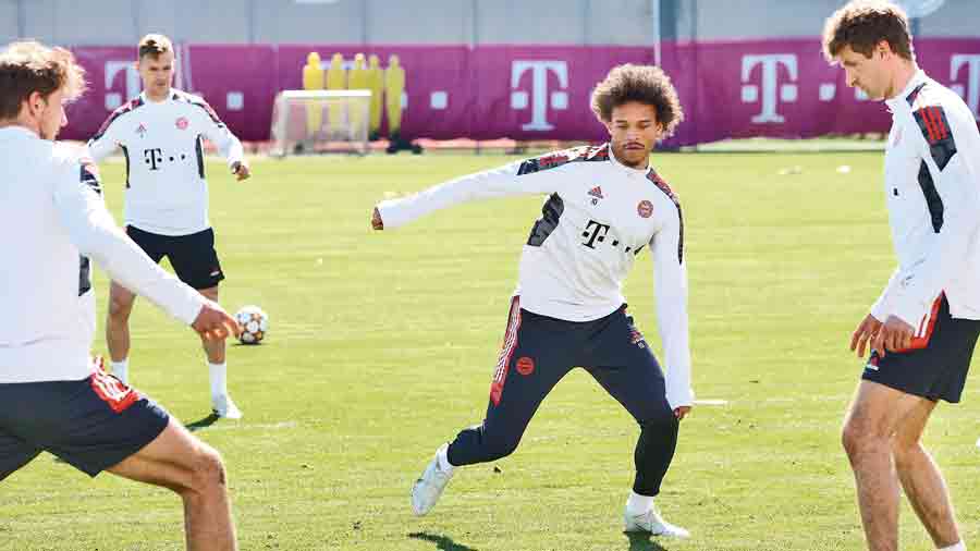 Leroy Sane (centre) practises with teammates during a Bayern Munich  training session in Munich on Monday. 