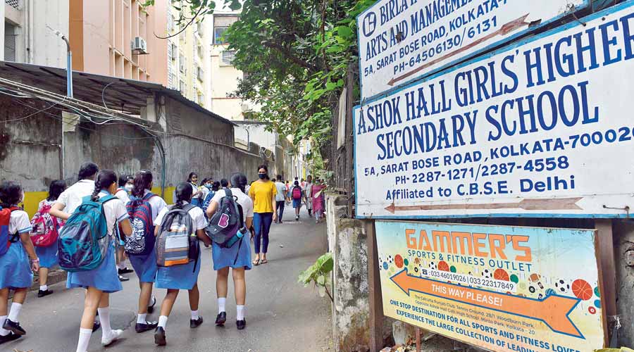 Students on their way to Ashok Hall Girls’ Higher Secondary School on Monday. 