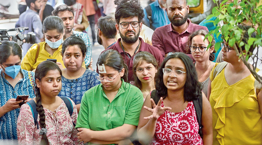 Injured JNU students and supporters of the All India Students Association address the  media in New Delhi on Monday. An MA sociology student, Akhtarista Ansari, is seen  with a bandage on her forehead. Ansari had been photographed in 2019 while shielding a student of Jamia Millia Islamia, where she studied then, from police batons during  a protest against the new citizenship regime.