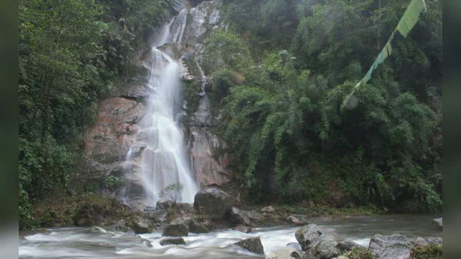 The misty Que Khola waterfall en route to Zuluk is worth a stop