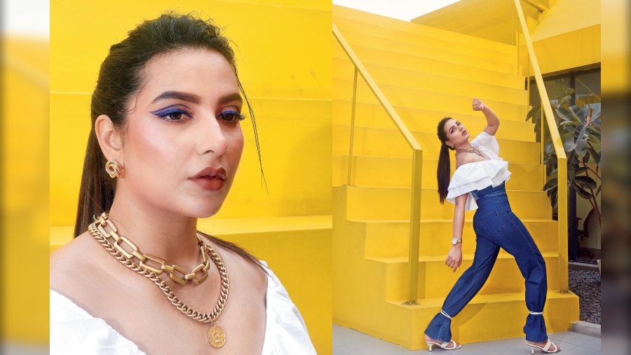 “The look was simple but the styling was great, especially the tie-ups on the bell-bottoms. I tried this for the first time. The play of blue against the yellow looked great,” said Subhashree about the denim-on-denim look with a ruffled white top. The sleek pony and electric blue graphic liner (inset) made it oh-so-cool!