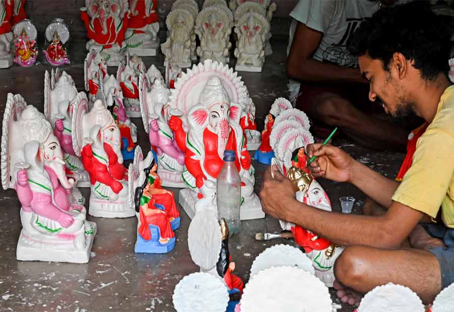 An artist paints an idol of Lord Ganesh at Kumartuli on Wednesday ahead of the Bengali New Year. The elephant god and goddess Laxmi are worshipped by merchants across the state on the Bengali New Year