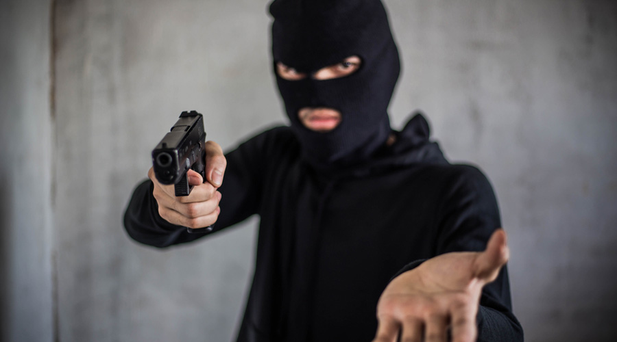 The robbers woke up all of them and forced them to enter a room at gunpoint.