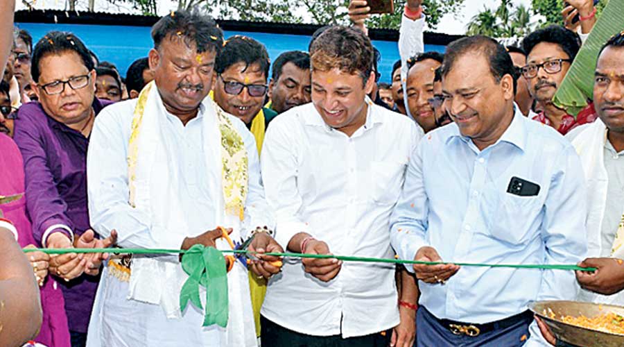 Minister Becharam Manna cuts a ribbon to mark the reopening of the Madhu tea estate on Wednesday. 
