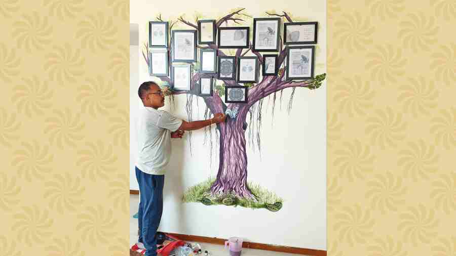Raghunath Behera paints a wall at a Uniworld City resident’s home 