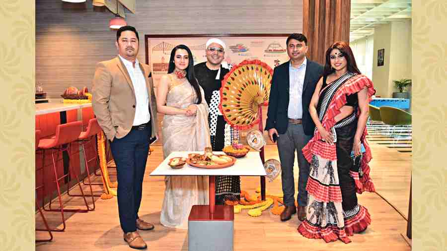 Actress Falaque Rashid Roy and designer Indroneel Mukherjee (second and third from left)  at the festival