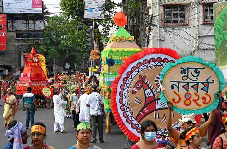 People walk in a procession to mark Poila Baisakh, the first day in the Bengali calendar, near Jadavpur on Friday