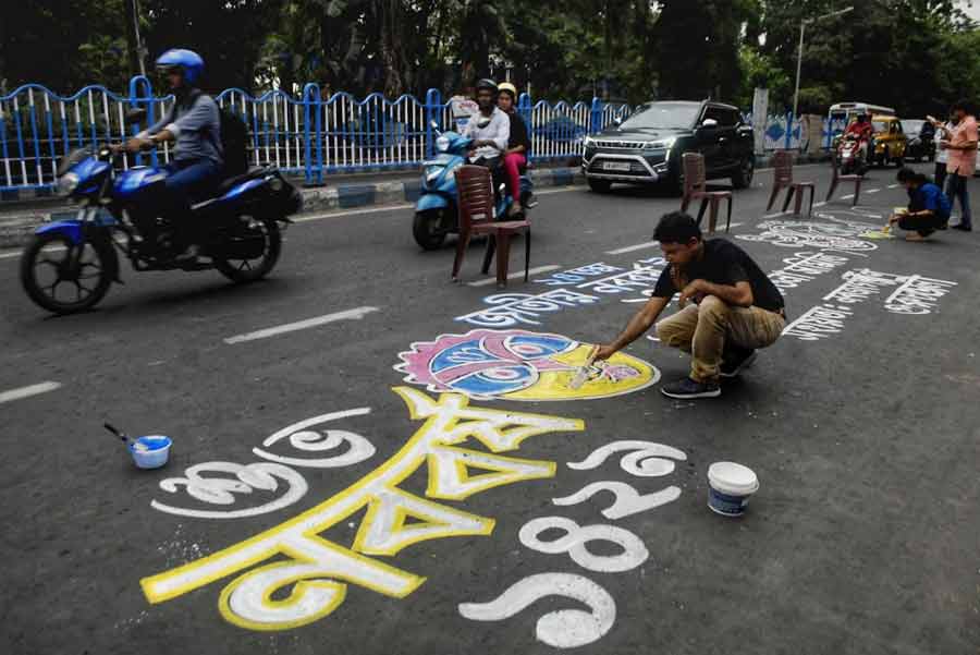 WELCOME: An artist paints a New Year greeting on a Kolkata road on Friday, April 15