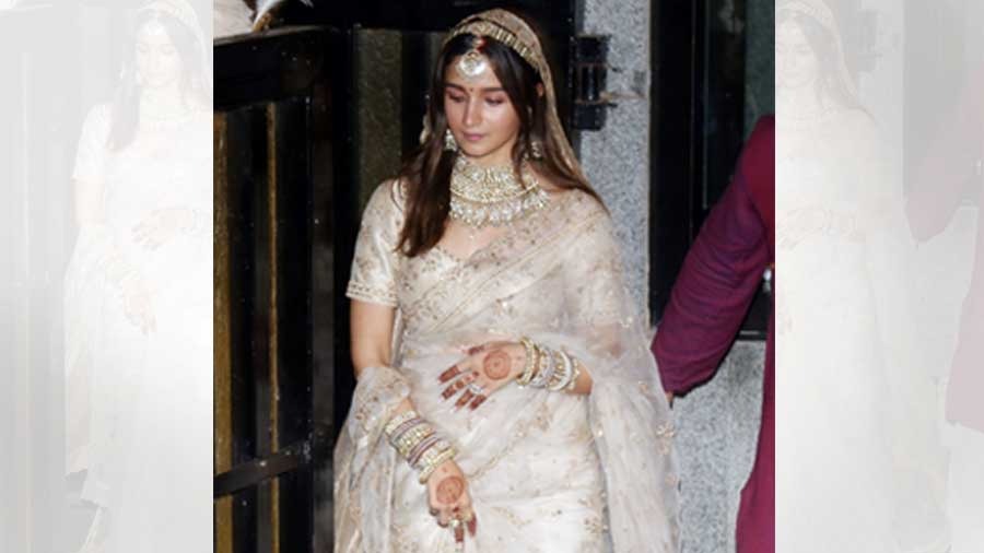 Alia Bhatt: Alia’s minimal bridal look cements the concept of ‘less is more’. Her hand-dyed ivory organza sari was embroidered with fine tilla work and was accompanied by a regal, embroidered tissue veil. The actor also had her wedding date embroidered on her veil