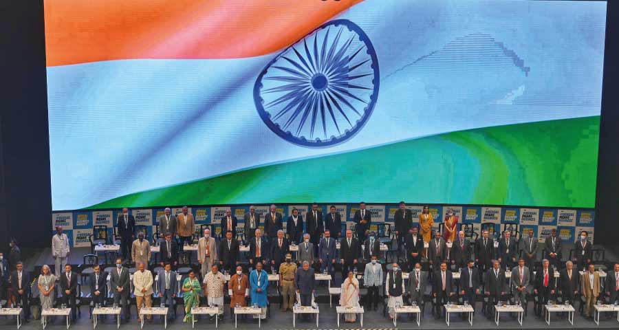 Participants rise during the playing of the National Anthem at the inaugural session of Bengal Global Business Summit at the Biswa Bangla Convention Centre on Wednesday. 
