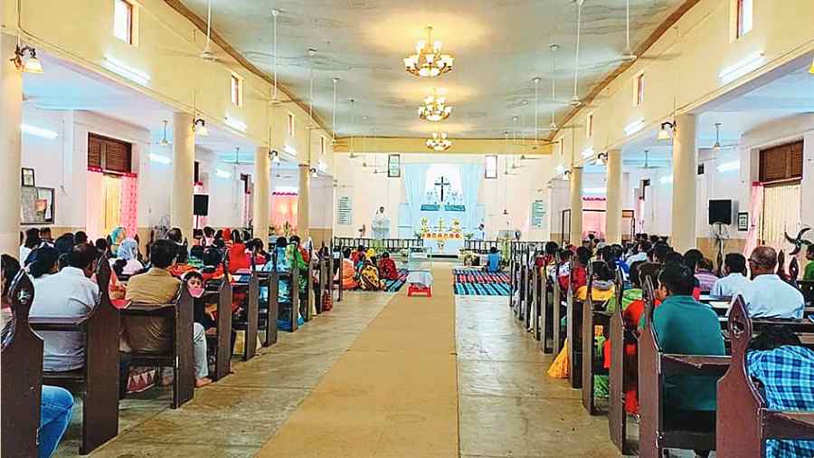 Devotees attend holy mass at Emmanuel Church in Kestopur. 