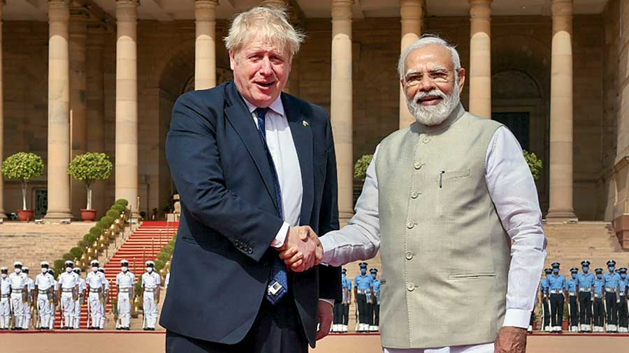 Prime Minister Narendra Modi shakes hands with British Prime Minister Boris Johnson after the ceremonial reception at Rashtrapati Bhavan in New Delhi