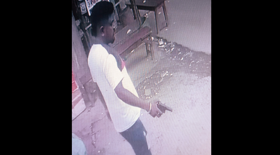 CCTV camera footage purportedly shows a man, whom police identified as Gopal Haldar, holding a gun at the wholesale fish market in Sonarpur