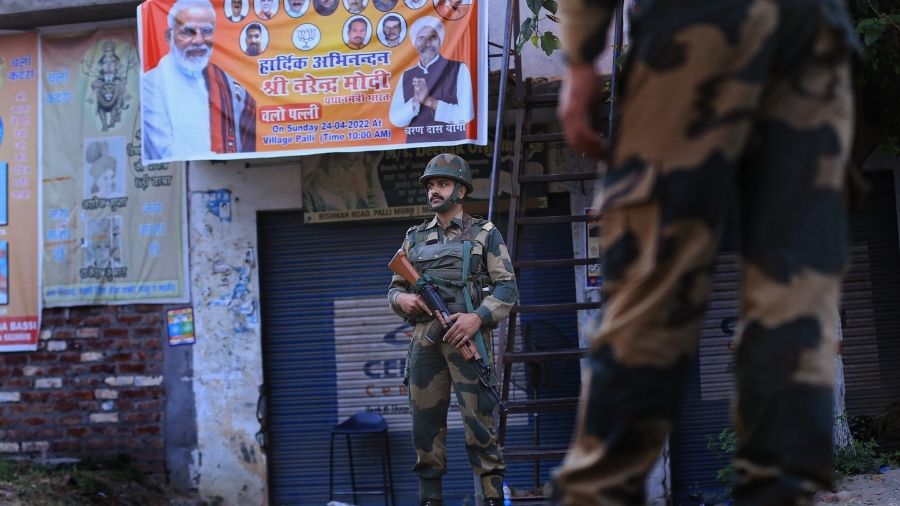 Border Security force (BSF) jawans stand guard near the venue of Prime Minister Narendra Modis upcoming rally at Palli village of Samba district on Saturday