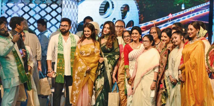 Members of the Bengali film industry pose with West Bengal chief minister Mamata Banerjee at the inauguration of Kolkata International Film Festival at Nazrul Mancha on Monday. The festival will continue till May 1