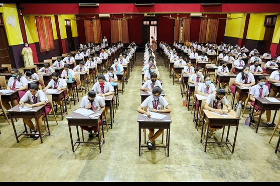 Students wore masks and maintained social distance at the exam hall. 