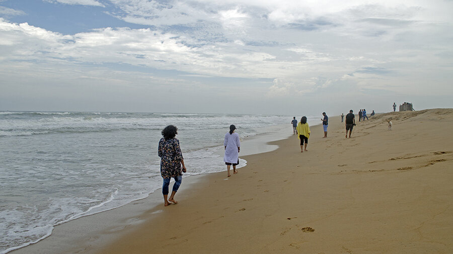 Crashing waves and makeshift food stalls greet visitors at the beach bordering Chilika and the Bay of Bengal