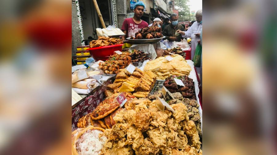 An array of fried snacks and skewered meats at Chowkbazar