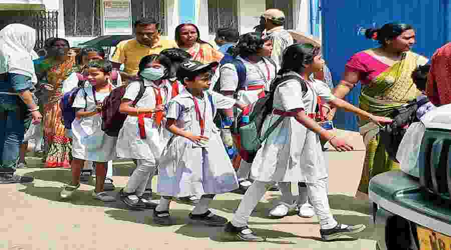 Students leave for home after school hours in Bankura on Thursday. 